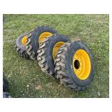 4 New 10-16.5 skid steer tires on rims