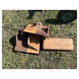 Landing pads for backhoe