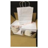 Box of white bags with handles