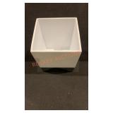 white and metal waste basket