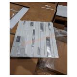 Box of peel and stick wall tiles