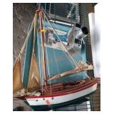 Bell and Howell movie camera and sailboat