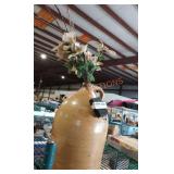 Pottery jug with lighted flowers