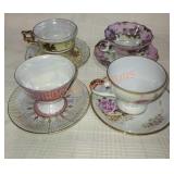 Set of 4 teacups and saucers