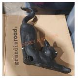 Stretching cat figurine