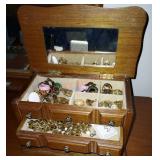 Small jewelry box full of costume jewelry