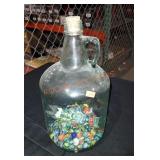 Glass jug with marbles