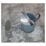 Vintage galvanized watering can