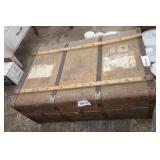 Antique luggage chest with travel stamps