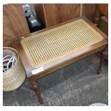 Small bench with cane seat