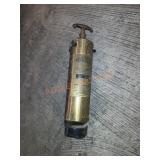 Antique verses brass extinguisher