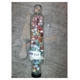 Vintage glass rolling pin full of marbles