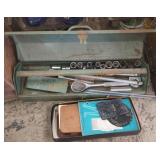 Vintage metal toolbox with contents