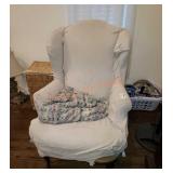 Wing back chair with cover and blanket