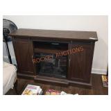 Entertainment center with built in fireplace