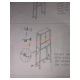 Behind the toilet shelf