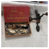 Antique crank drill and burn rite pen with