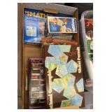 Box full of board games and puzzles