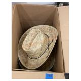 Box full of straw cowboy hats