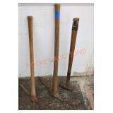 Vintage pick axes and sledge hammer