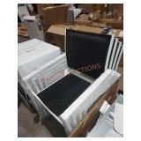 White and Black Stackable Outdoor Chairs