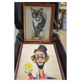 Framed needlepoint art of clown and cat