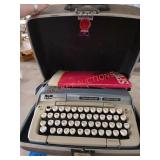 Smith corona galaxie deluxe typewriter and paper