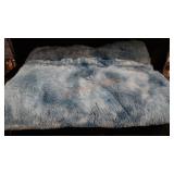 Large blue fuzzy dog bed