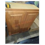 30" W x 12" D x 36" H wall cabinet oak colored