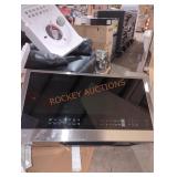 LG black stainless microwave oven with touchscreen