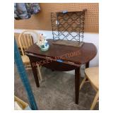 Approximately 41 inch round drop leaf dining table