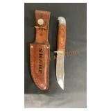 Sharp wooden handled knife with sheath