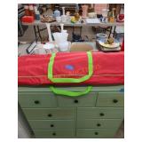 Storage bag with gift bags and wrapping supplies