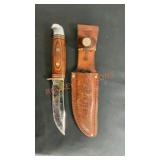 Sharp wooden handled knife with sheath
