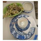 Blue and white glassware and faux grapes in