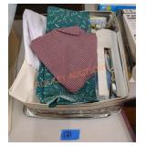 Vintage tin with fabric and sewing supplies