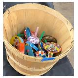 Apple basket full of Vintage noisemakers