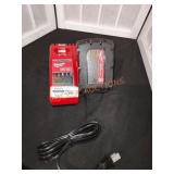 Milwaukee 18V 2.0AH Battery and Charger. Located