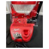 Milwaukee 12V 4Ah. Battery and charger. Located