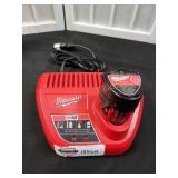 Milwaukee 12V 2.0Ah. Battery and charger. Located