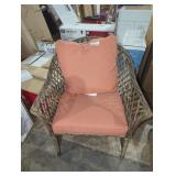 Hampton Bay wicker patio chair with orange