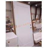 31" x 80" white exterior door in a frame rh