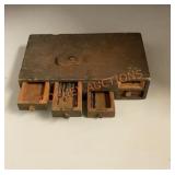 Antique miniature wooden toolbox with drillbits