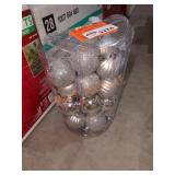 Container of silver Christmas balls