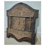 "The Pewter Shop" Faux Wood Wall Clock