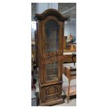 Tall thin glass front lighted storage hutch