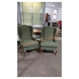 Pair of green wingback chairs