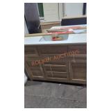 33in by 48in brown vanity with white top