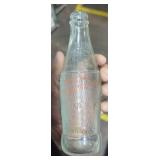 Vintage soda and measurement bottles