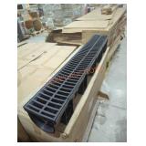 Box of plastic drains with lids